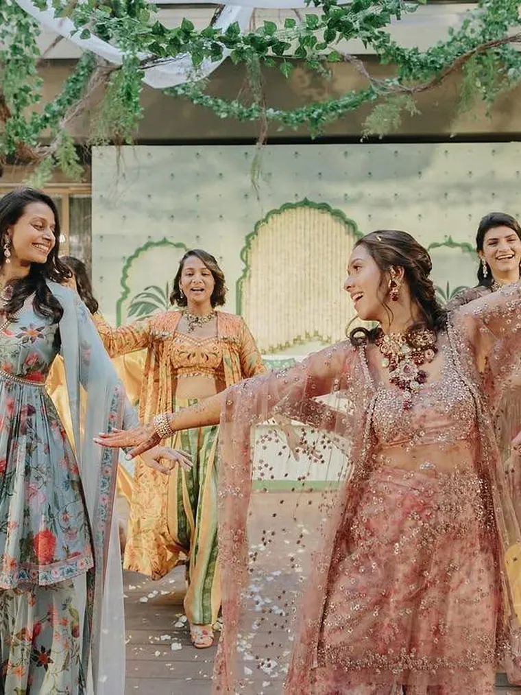 The bride and her friends performing at a mehendi