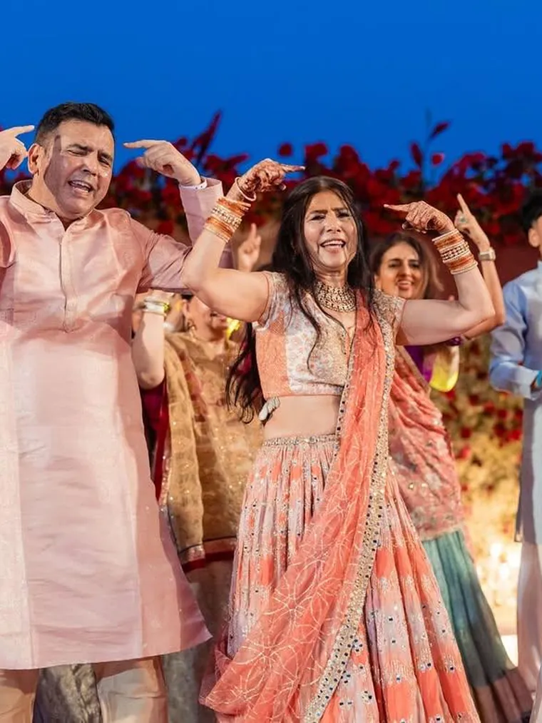 Family performing together at a sangeet