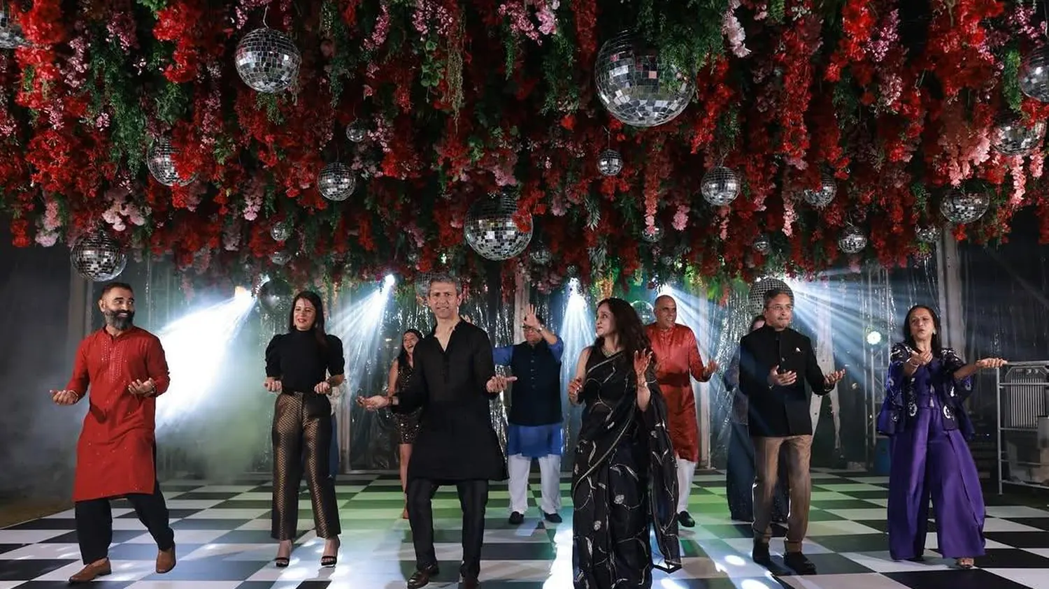 A sangeet performance on a mirrored dance floor